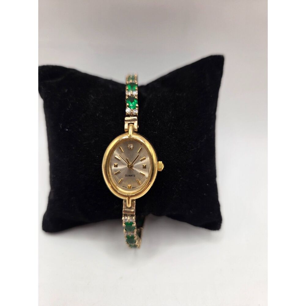 1753. Vintage Gold Tone Quartz Bracelet Watch with Green Gemstones